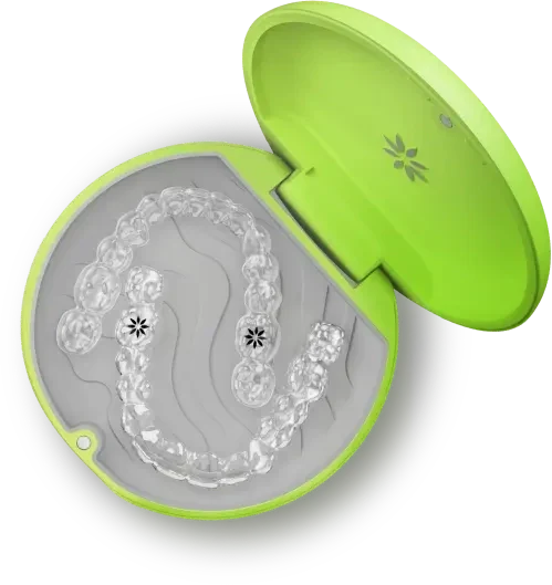Open neon Invisalign case holding clear aligners